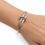 دستبند زنانه سلین CELINE Knot نقره‌ای مدل Extra-Thin مستر کوالیتی - تصویر 2